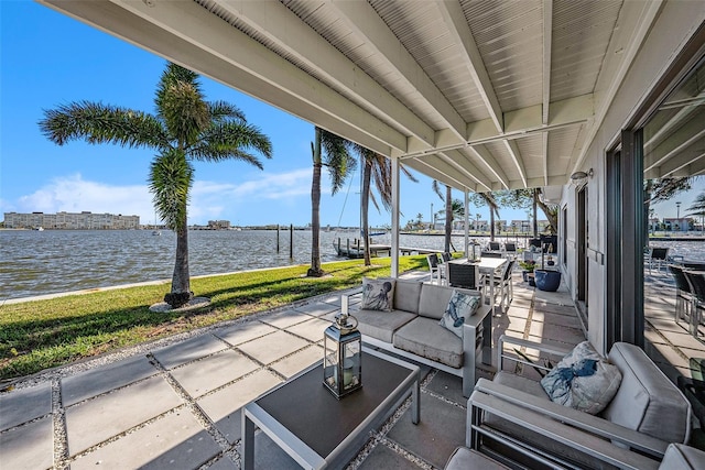 view of patio / terrace with a water view and an outdoor hangout area