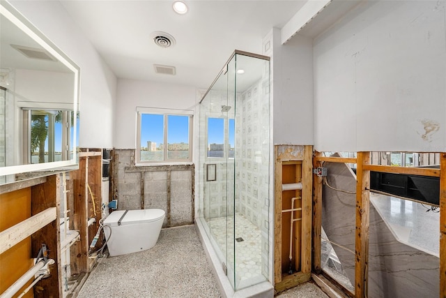 bathroom featuring toilet, walk in shower, and tile walls