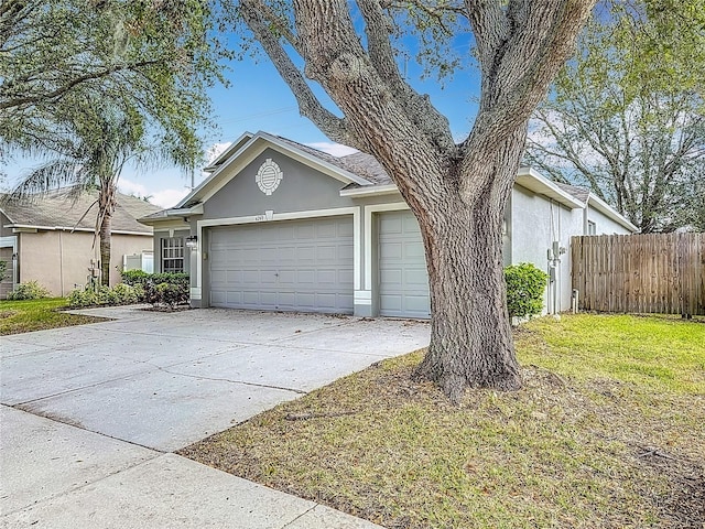 view of front facade with a front yard and a garage