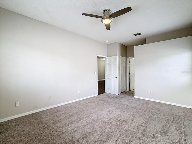 unfurnished bedroom with ceiling fan and carpet flooring