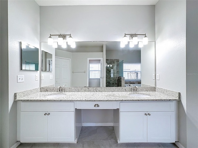 bathroom featuring vanity, tile patterned floors, and a shower with shower door