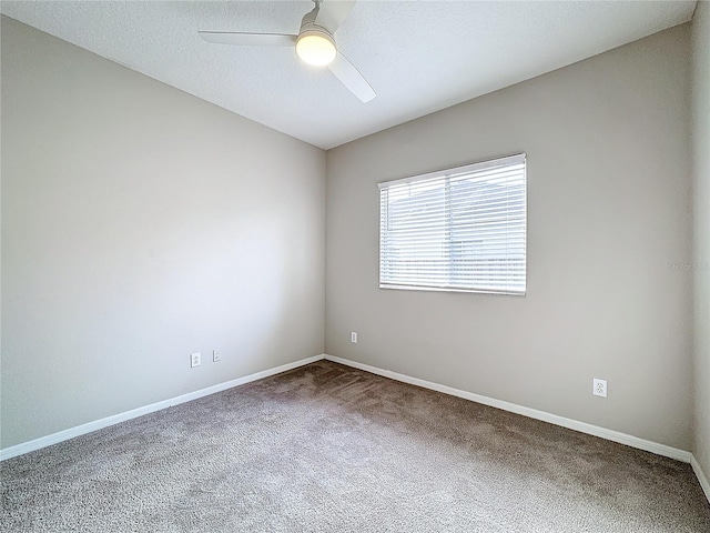 carpeted empty room with ceiling fan