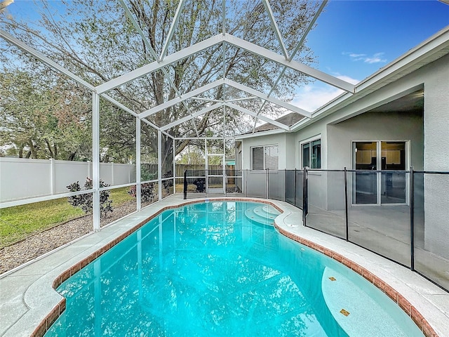 view of swimming pool with a lanai