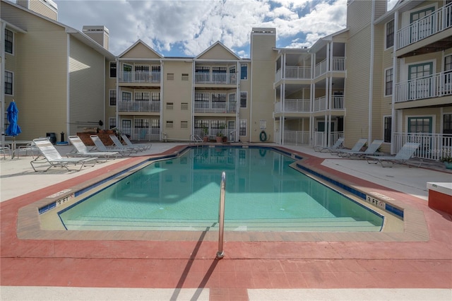 view of swimming pool featuring a patio