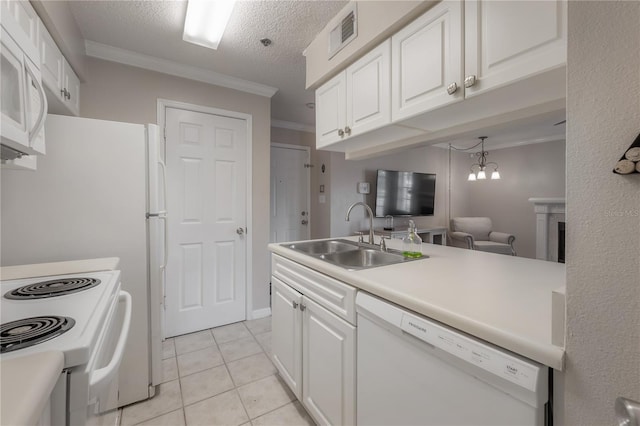 kitchen featuring sink, a notable chandelier, crown molding, white appliances, and white cabinets