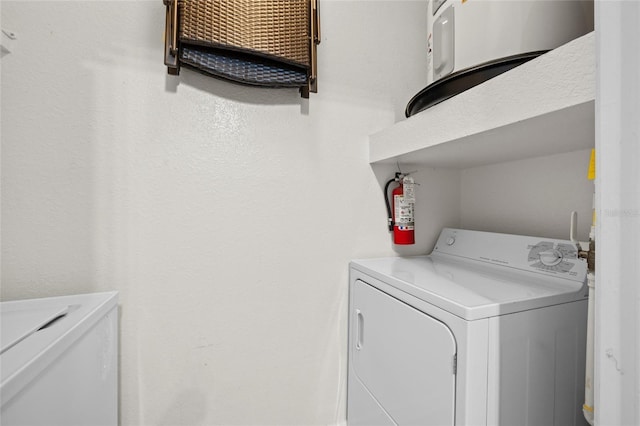 5000 Culbreath Key Way Unit 4-206, Tampa, FL 33611 - washroom featuring water heater and washing machine and dryer