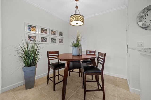 5000 Culbreath Key Way Unit 4-206, Tampa, FL 33611 - dining space featuring ornamental molding, light tile patterned flooring, and baseboards