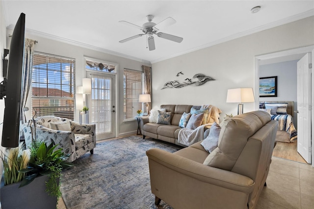 living room with ceiling fan, ornamental molding, and light hardwood / wood-style flooring