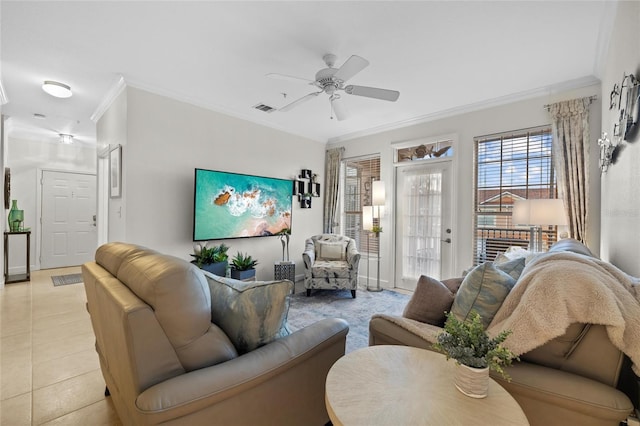 tiled living room featuring ceiling fan and ornamental molding