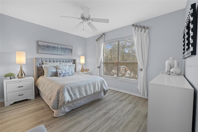 bedroom with light wood-type flooring and ceiling fan