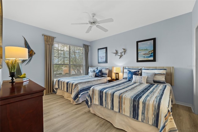 5000 Culbreath Key Way Unit 4-206, Tampa, FL 33611 - bedroom with light wood-type flooring, ceiling fan, and baseboards