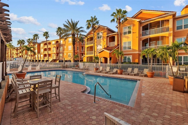 view of swimming pool with a patio