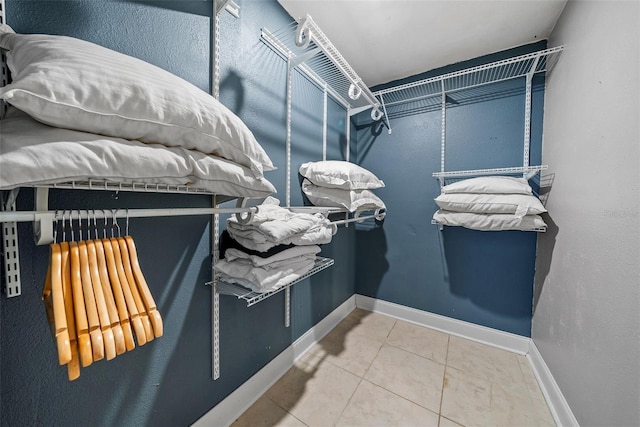 spacious closet with tile patterned flooring