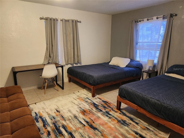 bedroom with light tile patterned floors