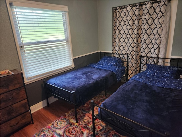 bedroom with hardwood / wood-style floors