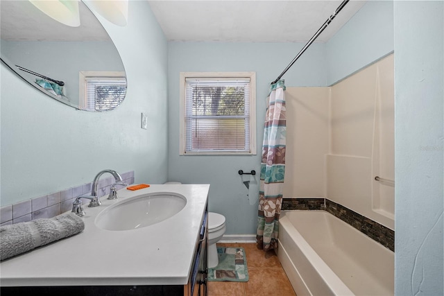 full bathroom featuring vanity, shower / bath combo, tile patterned flooring, ceiling fan, and toilet