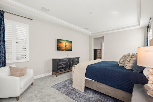 carpeted bedroom featuring a raised ceiling and crown molding