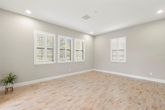 unfurnished room featuring light hardwood / wood-style flooring