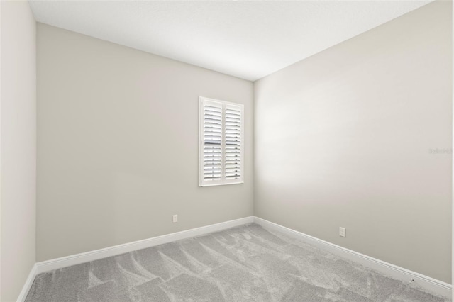 spare room with light carpet