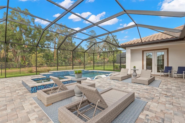 view of patio / terrace with a pool with hot tub, glass enclosure, and french doors