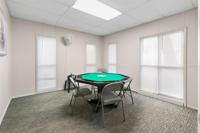 recreation room with a drop ceiling and carpet