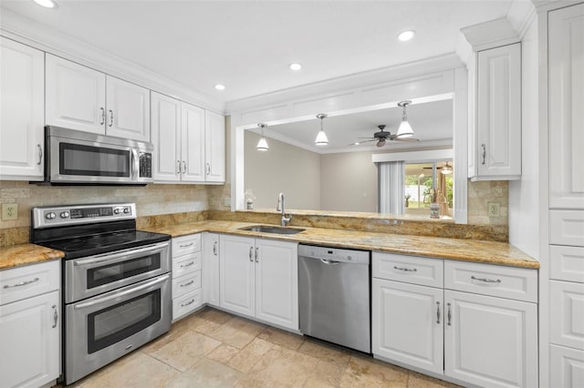 kitchen with white cabinetry, sink, crown molding, and stainless steel appliances