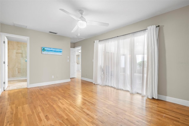 spare room featuring ceiling fan and light hardwood / wood-style flooring