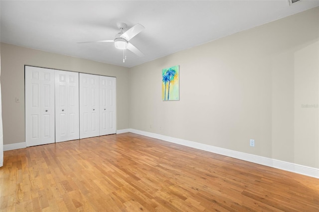 unfurnished bedroom with a closet, ceiling fan, and light hardwood / wood-style flooring