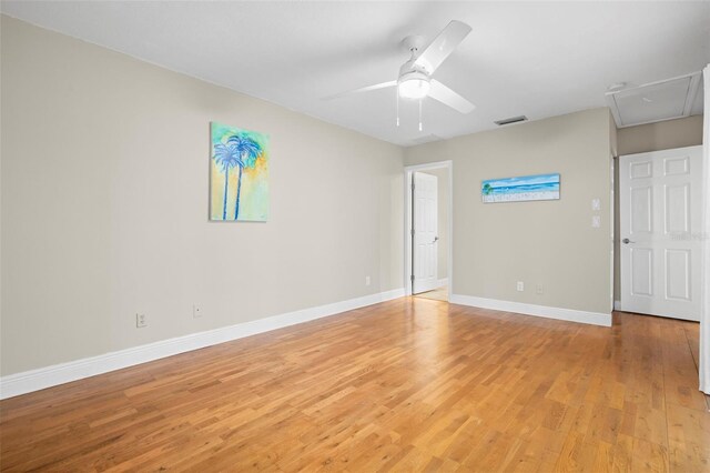 spare room featuring light hardwood / wood-style flooring and ceiling fan