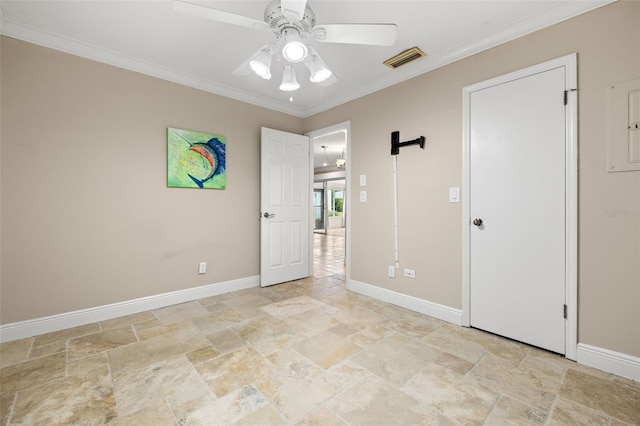 empty room featuring ceiling fan and ornamental molding