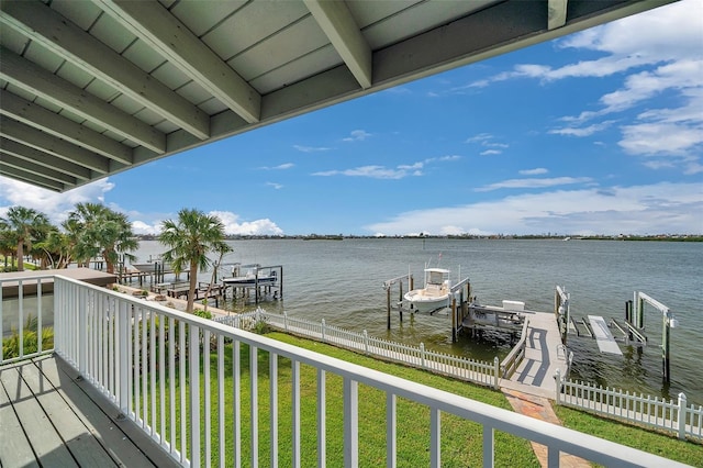 exterior space featuring a water view and a lawn