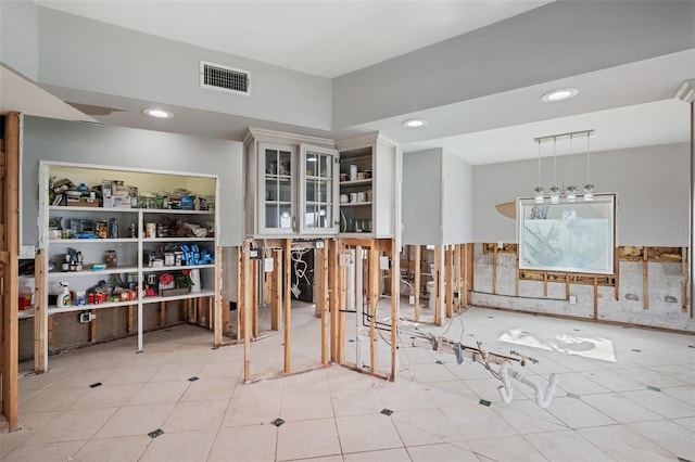 miscellaneous room with light tile patterned floors