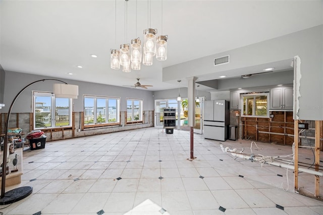 interior space featuring ceiling fan and light tile patterned flooring