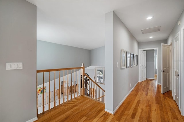 corridor with light hardwood / wood-style flooring