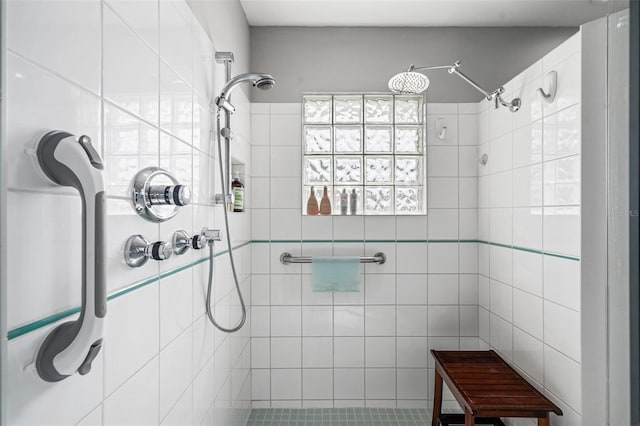 bathroom with tiled shower