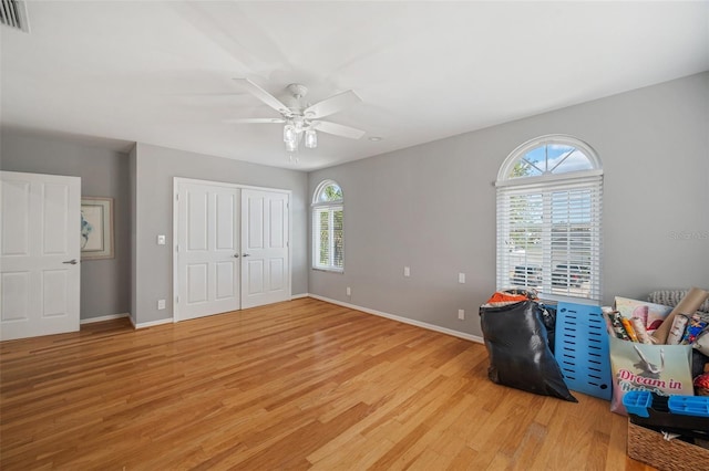 bedroom with light hardwood / wood-style flooring and ceiling fan