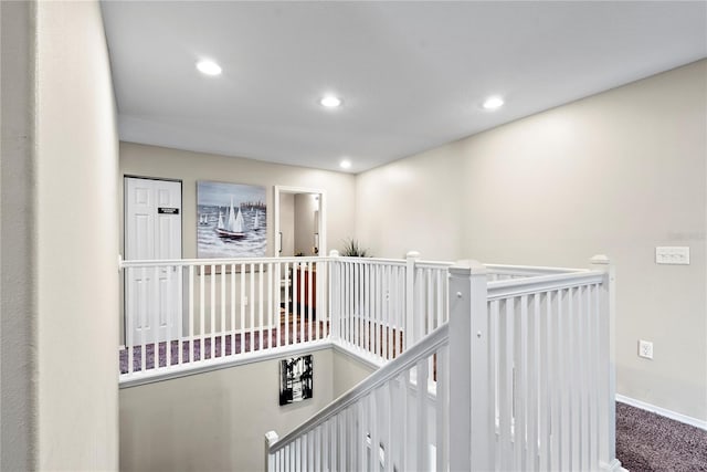 corridor with carpet floors