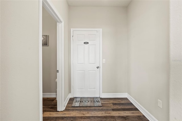 hallway featuring dark wood-type flooring