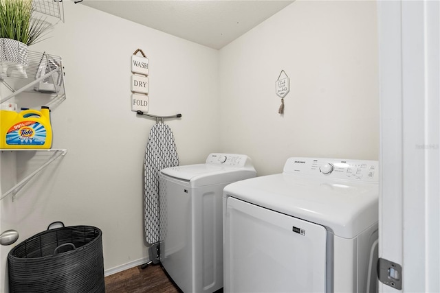 laundry area featuring dark hardwood / wood-style flooring and independent washer and dryer