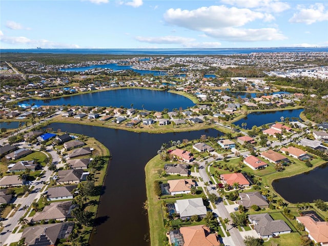 birds eye view of property featuring a water view