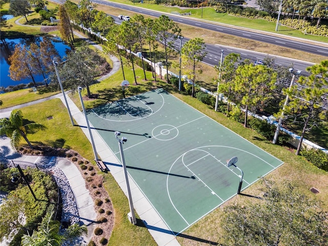 view of sport court featuring a water view