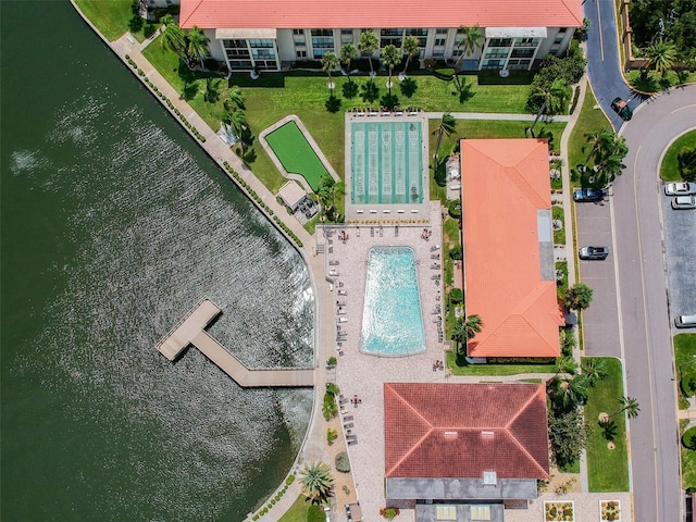 birds eye view of property with a water view