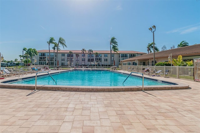 view of swimming pool with a patio area