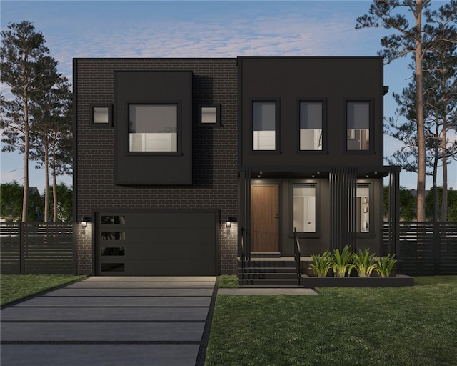 view of front facade with fence, driveway, an attached garage, a front lawn, and brick siding