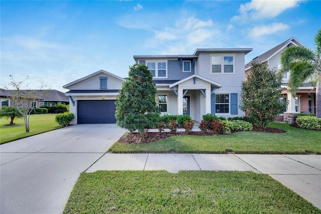 view of front of home with a front lawn and a garage