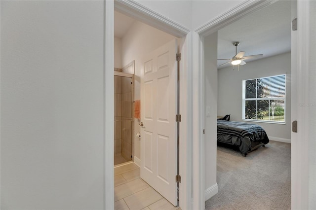 hallway featuring light carpet