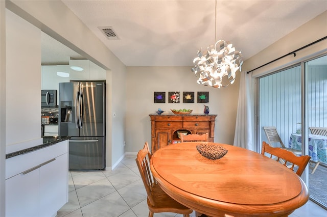 dining area with an inviting chandelier and light tile patterned floors