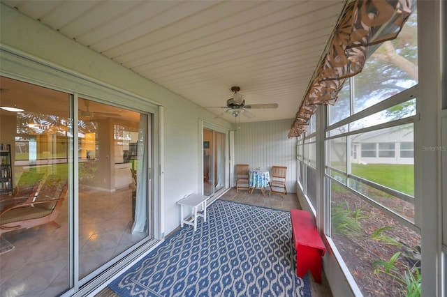 sunroom featuring a wealth of natural light and ceiling fan