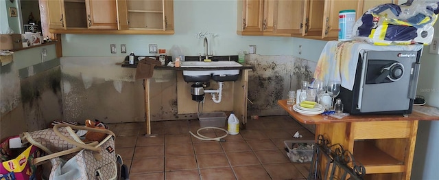 kitchen with dark tile patterned floors