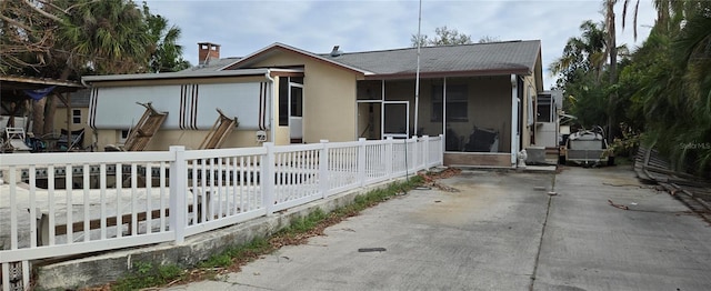 exterior space featuring a sunroom